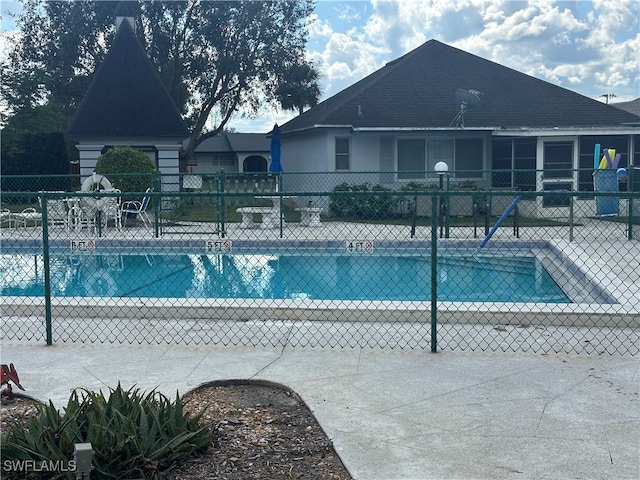 view of swimming pool featuring a patio area