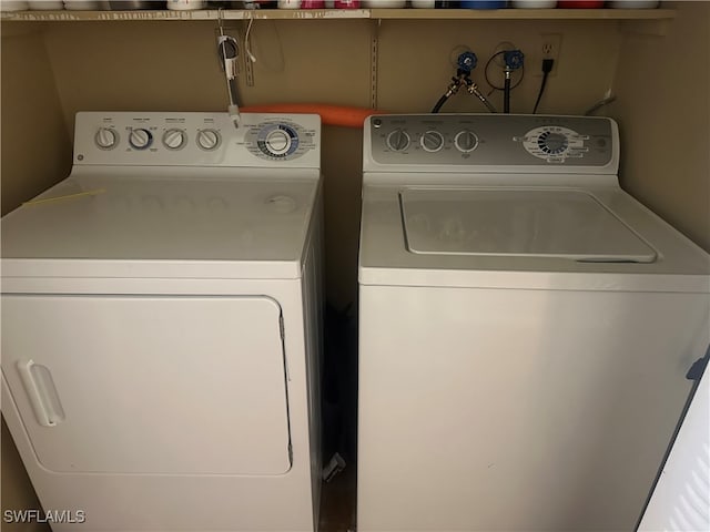 washroom featuring washer and clothes dryer