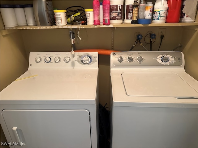 clothes washing area featuring washing machine and dryer