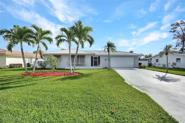 ranch-style house with a garage and a front lawn