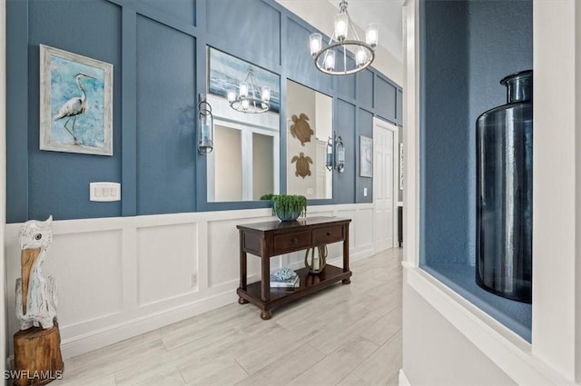 foyer featuring a notable chandelier and light hardwood / wood-style floors