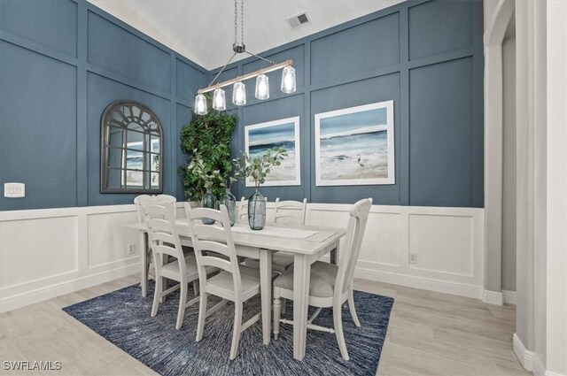 dining room with light hardwood / wood-style flooring