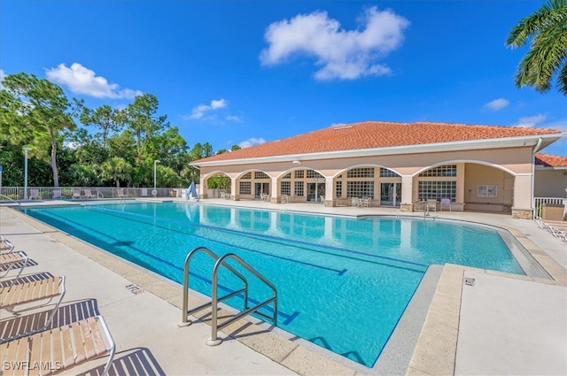 view of swimming pool with a patio