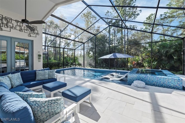 view of swimming pool featuring a lanai, ceiling fan, a patio area, and an outdoor hangout area