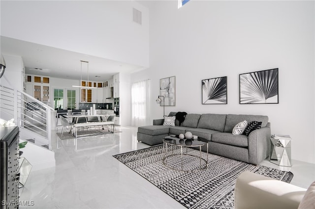 living room with a towering ceiling