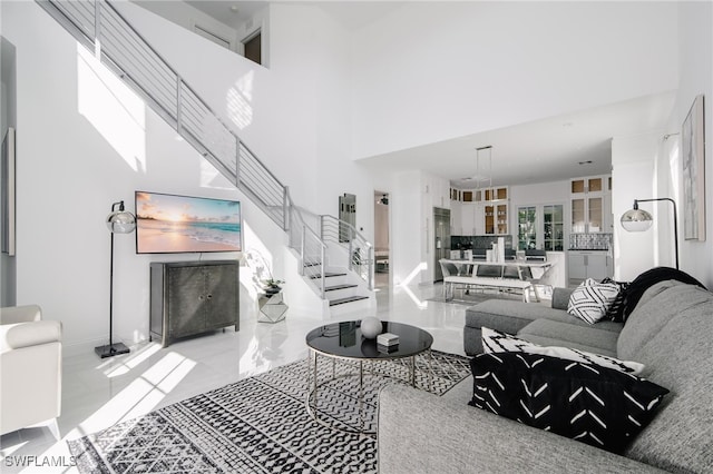 living room featuring a high ceiling