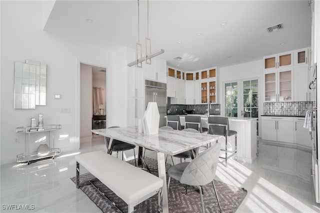 dining space featuring french doors