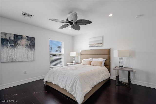 bedroom with dark hardwood / wood-style floors and ceiling fan