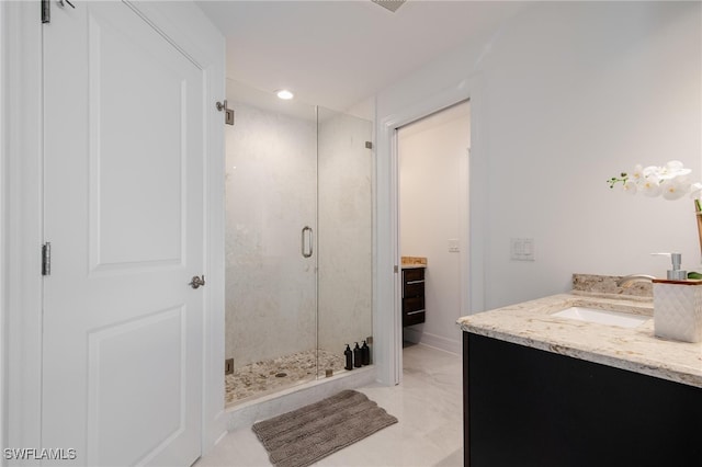 bathroom featuring vanity and walk in shower