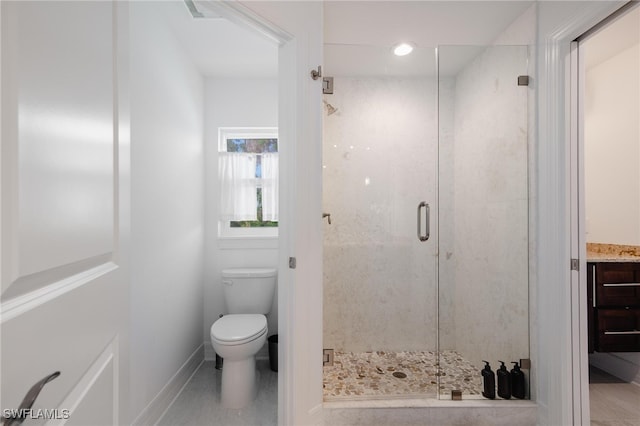 bathroom with vanity, toilet, and walk in shower