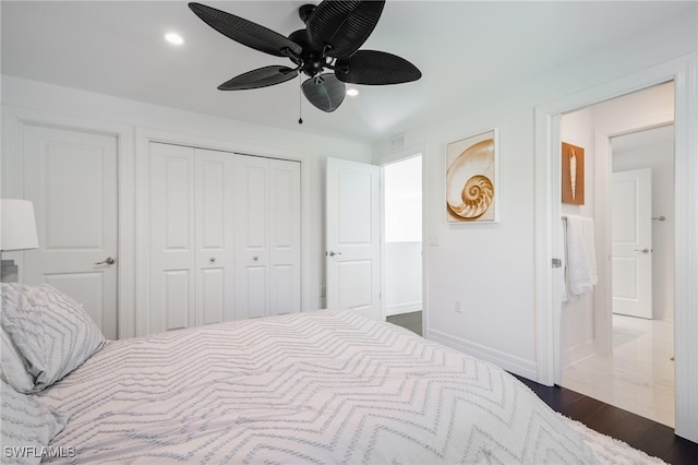 bedroom featuring dark wood-type flooring, ceiling fan, and a closet