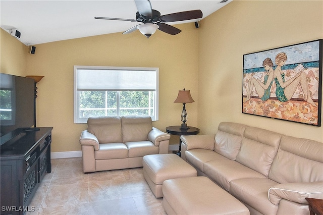 living room featuring ceiling fan and vaulted ceiling