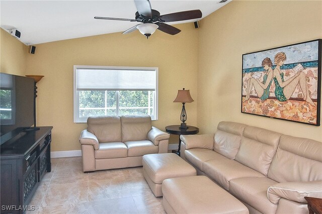9812 Fathom Ct, Fort Myers, FL 33919 - living room featuring vaulted ceiling, light tile patterned floors, a ceiling fan, and baseboards