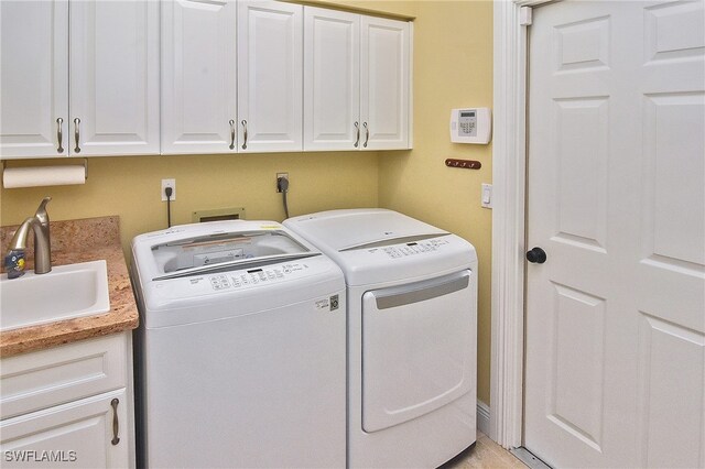 9812 Fathom Ct, Fort Myers, FL 33919 - laundry area featuring cabinet space and washer and dryer