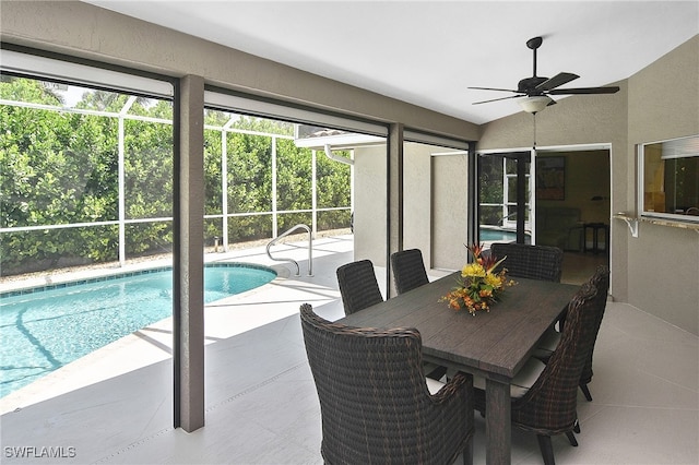 9812 Fathom Ct, Fort Myers, FL 33919 - swimming pool with a patio area, a ceiling fan, and glass enclosure