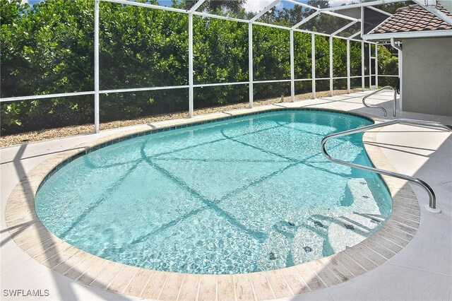 9812 Fathom Ct, Fort Myers, FL 33919 - swimming pool with a patio area and a lanai