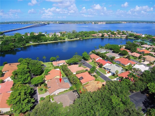 9812 Fathom Ct, Fort Myers, FL 33919 - aerial view of property's location featuring a notable bridge, a large body of water, and nearby suburban area