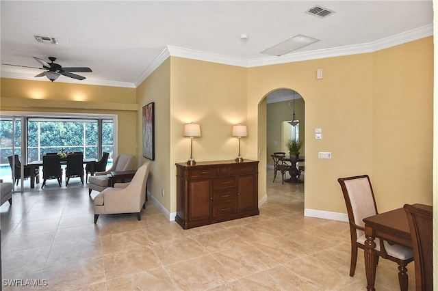 living area with ceiling fan and crown molding