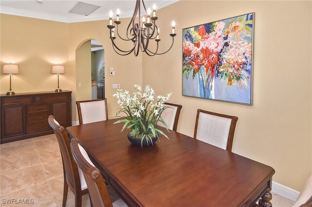 9812 Fathom Ct, Fort Myers, FL 33919 - dining area with arched walkways, crown molding, and a chandelier