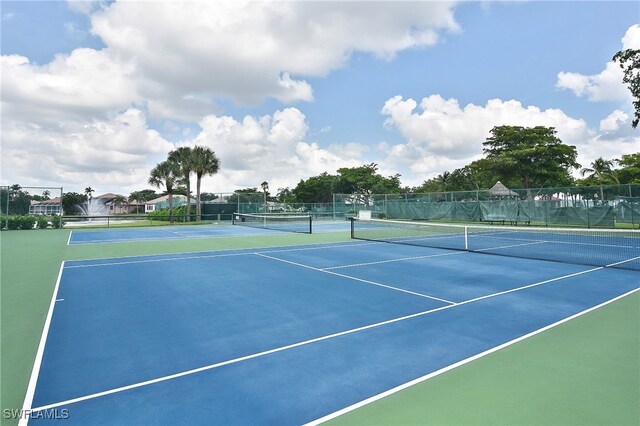 9812 Fathom Ct, Fort Myers, FL 33919 - view of tennis court featuring fence and community basketball court