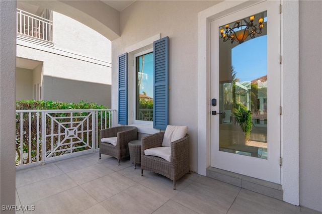 view of patio featuring a balcony