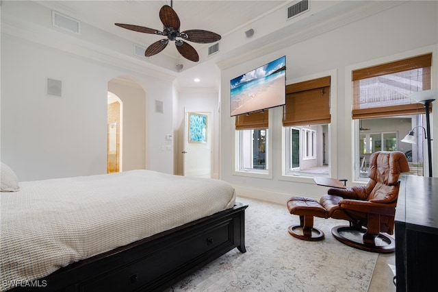 bedroom with ornamental molding and ceiling fan