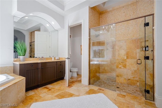 full bathroom featuring vanity, toilet, ornamental molding, and separate shower and tub