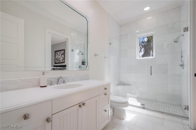 bathroom featuring tile patterned floors, toilet, a shower with shower door, crown molding, and vanity