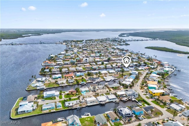 birds eye view of property featuring a residential view and a water view