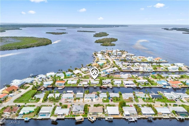 drone / aerial view featuring a water view and a residential view