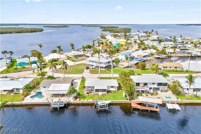 bird's eye view featuring a residential view and a water view