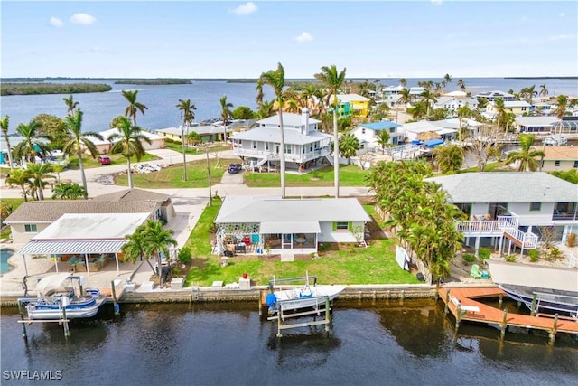 birds eye view of property featuring a water view and a residential view