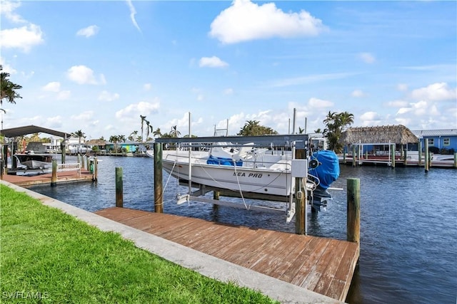 view of dock featuring a water view and boat lift