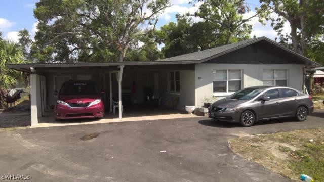 ranch-style home with a carport