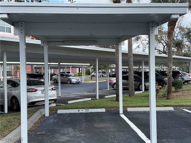 view of vehicle parking with a carport