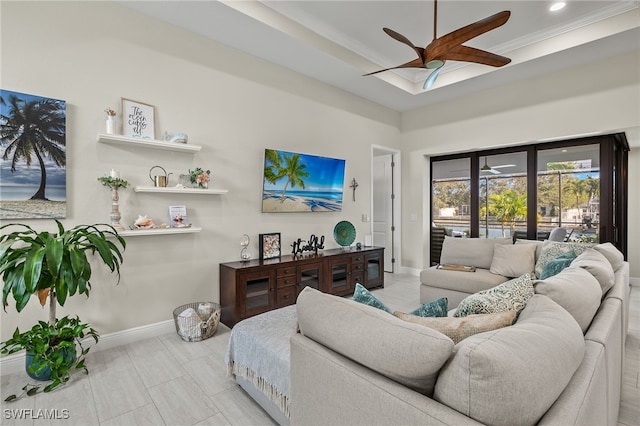 living room featuring ceiling fan and ornamental molding