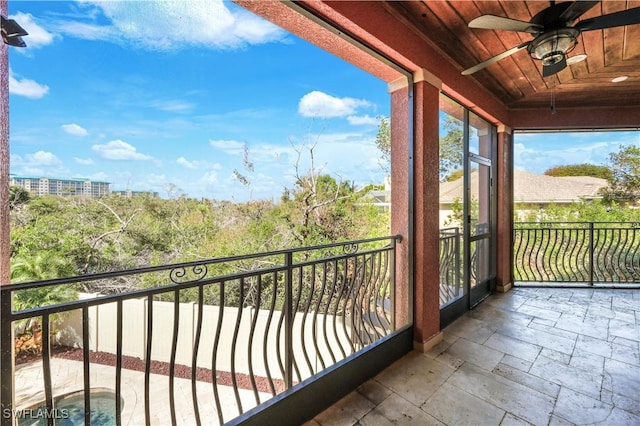 balcony featuring a ceiling fan