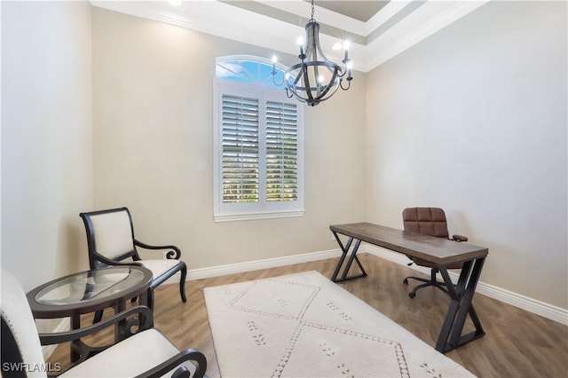 office with baseboards, wood finished floors, and ornamental molding