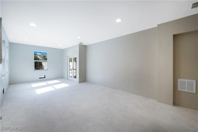 spare room with visible vents, french doors, and recessed lighting