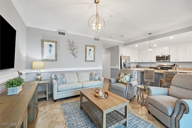 living room featuring a chandelier, light tile patterned floors, and ornamental molding