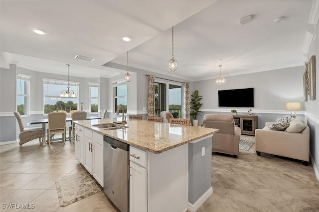 kitchen featuring white cabinets, sink, a kitchen island with sink, stainless steel dishwasher, and decorative light fixtures