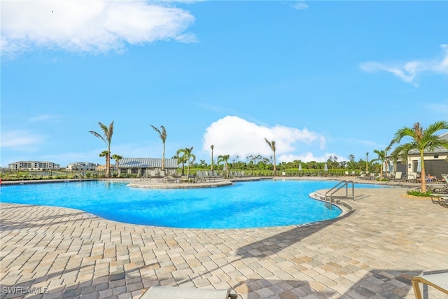 view of swimming pool featuring a patio area