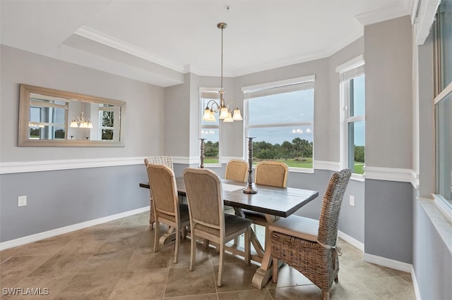 dining space featuring a chandelier, ornamental molding, and plenty of natural light