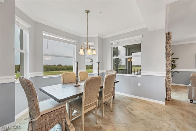 dining area featuring ornamental molding and a notable chandelier