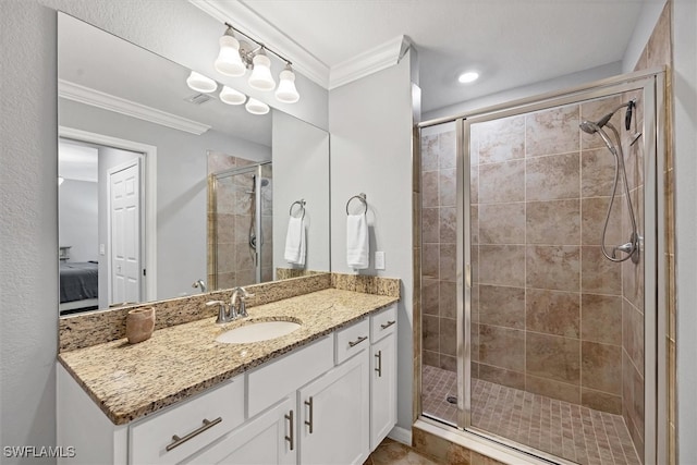 bathroom featuring walk in shower, vanity, and crown molding