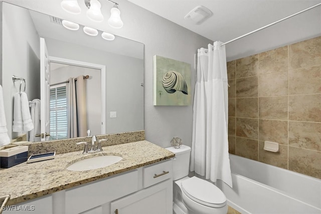 full bathroom featuring toilet, vanity, and shower / bath combo with shower curtain