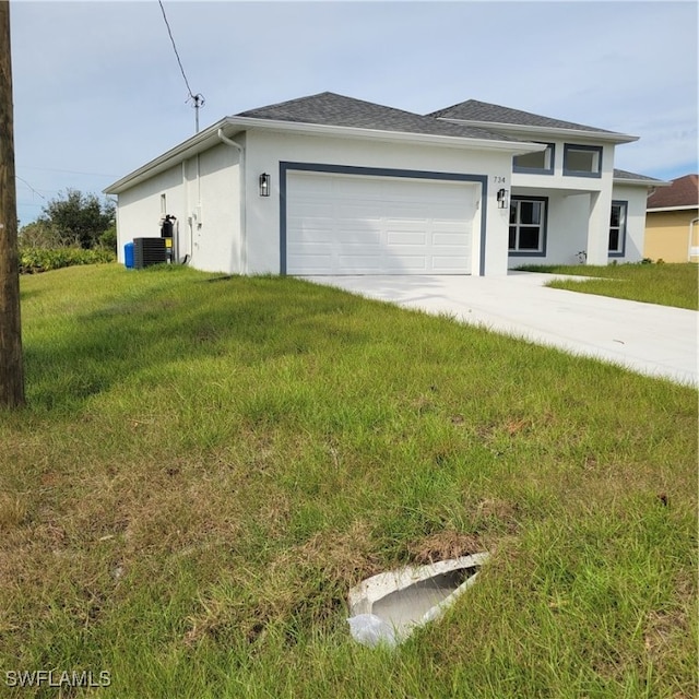 view of front of property with a front lawn, a garage, and cooling unit