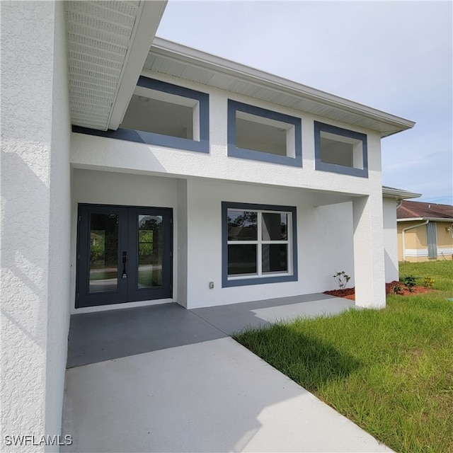 doorway to property featuring french doors