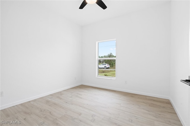 unfurnished room with light wood-type flooring and ceiling fan