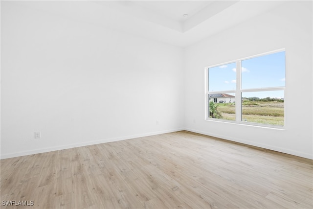 empty room with light hardwood / wood-style floors